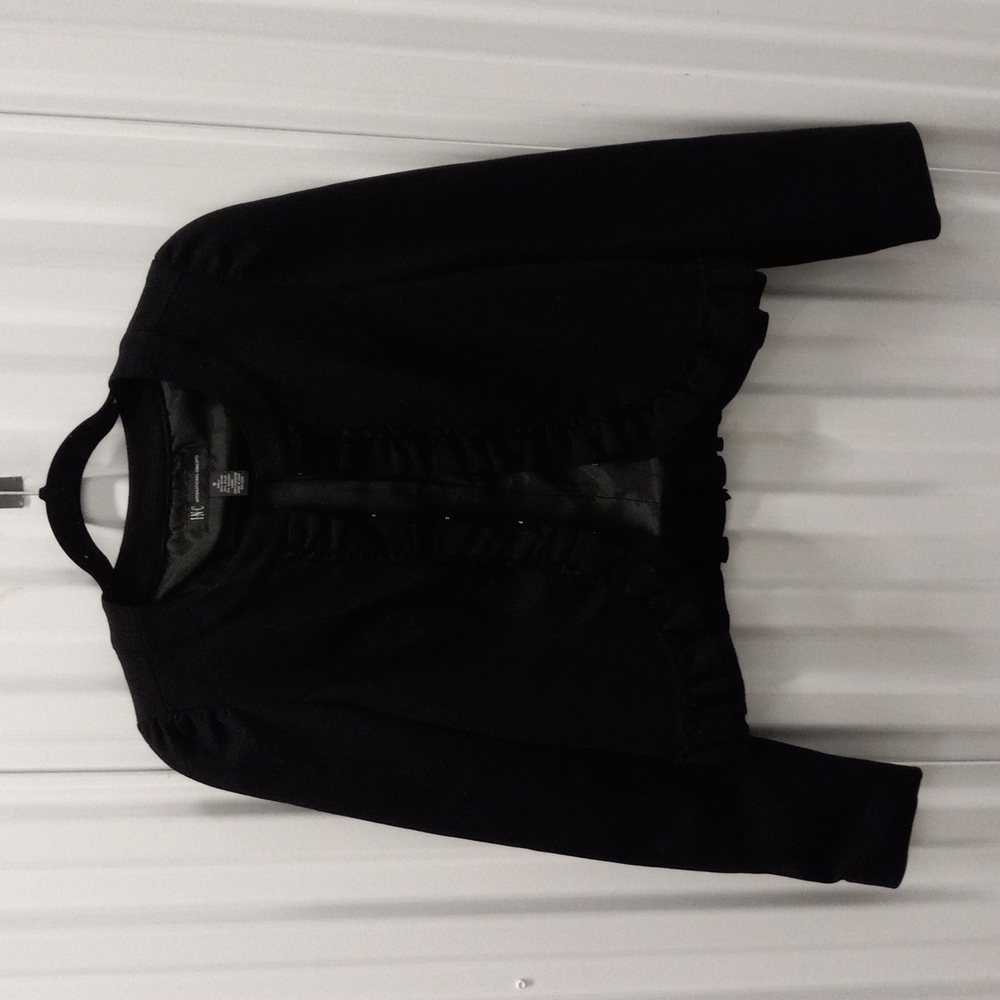 Bolero jacket with ruffles.